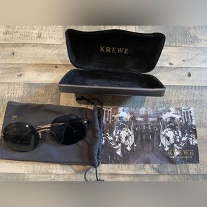 Krewe round sunglasses with case, cleaning cloth, and dust bag